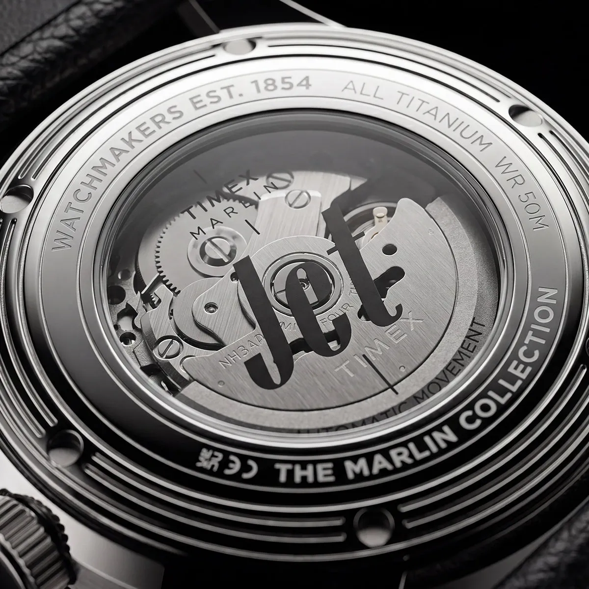 Close-up of Timex Marlin Jet Titanium Automatic GMT dial with GMT hand and date window