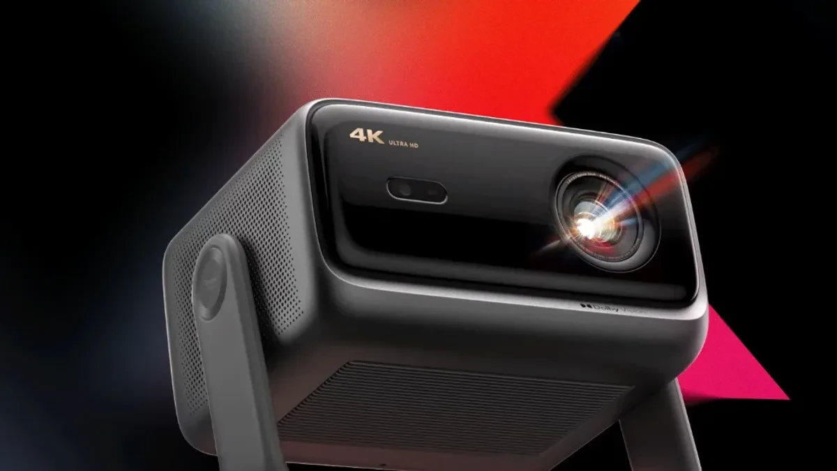 The Dangbei X9 Max 4K laser projector showing a vibrant home cinema interface.