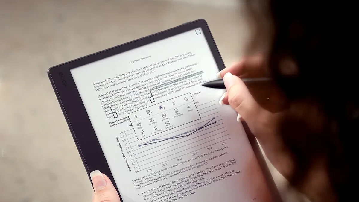 Boox Note Mini C color E Ink tablet held in hand displaying apps and handwritten notes