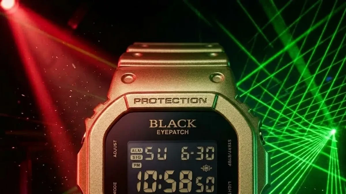 The G-Shock DW-5600BEP-9 featuring a gold-tone bezel and black face, shown alongside its special edition streetwear packaging.