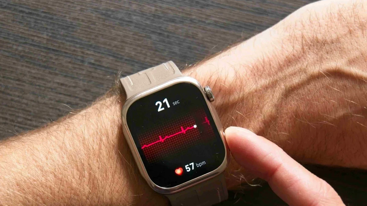 A close-up of the Huawei Watch D3 displaying an ECG trace on its screen