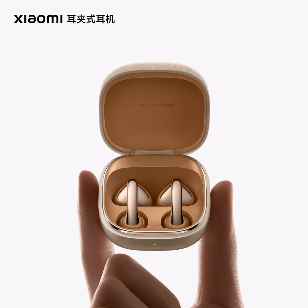 Close-up of Xiaomi earbuds with vinyl record-like metallic texture