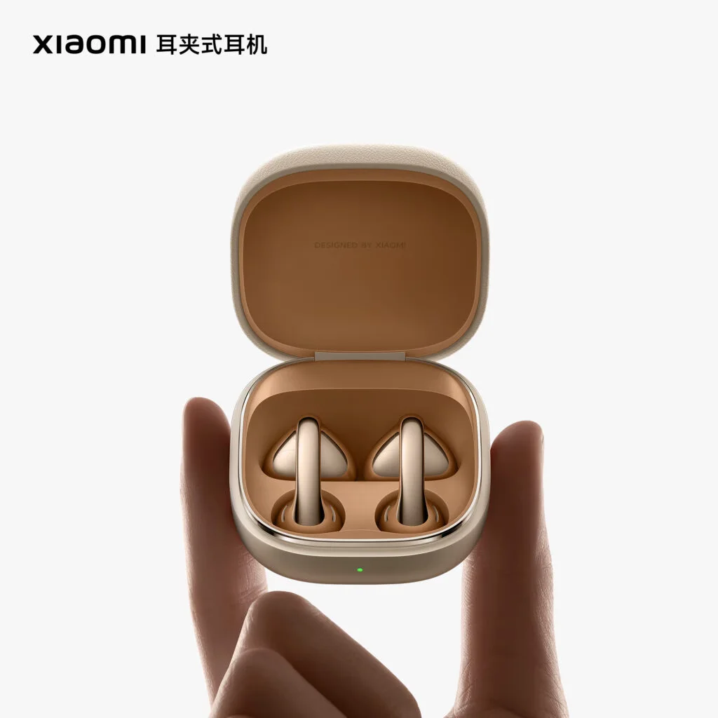 Close-up of Xiaomi earbuds with vinyl record-like metallic texture