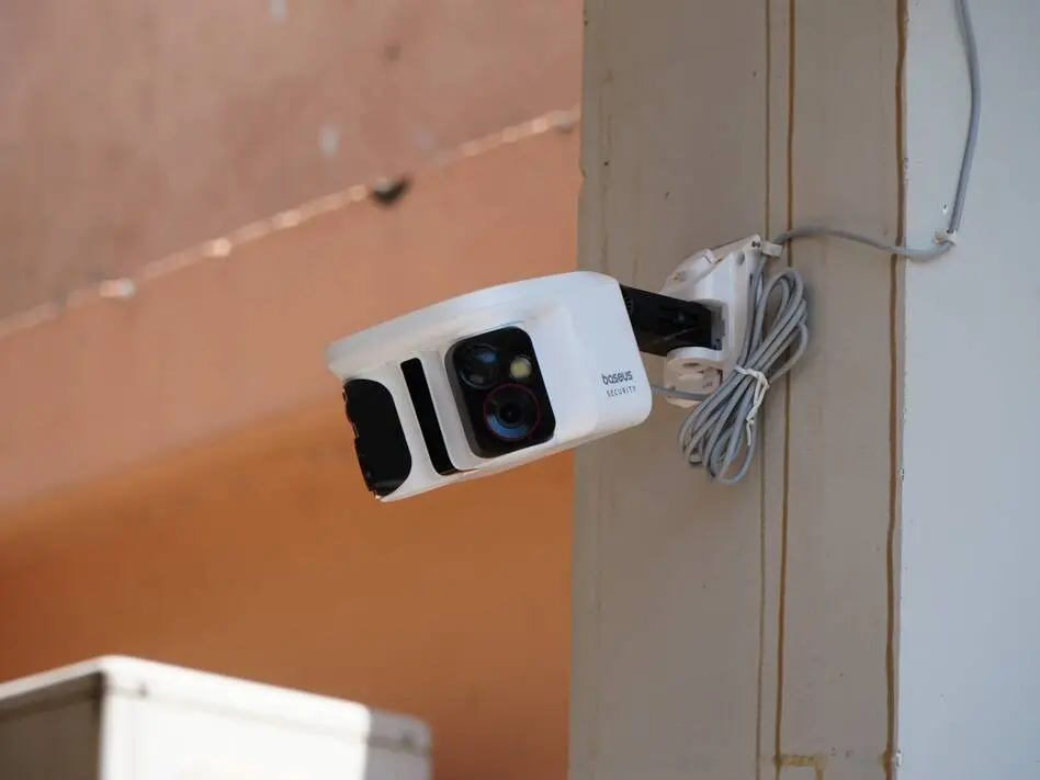 Baseus X1 Pro Camera Slashes Price with Solar-Powered Security Coverage Baseus X1 Pro security camera with solar panel mounted outdoors